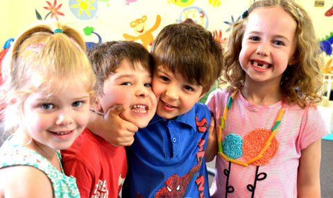 A group of smiling preschool children